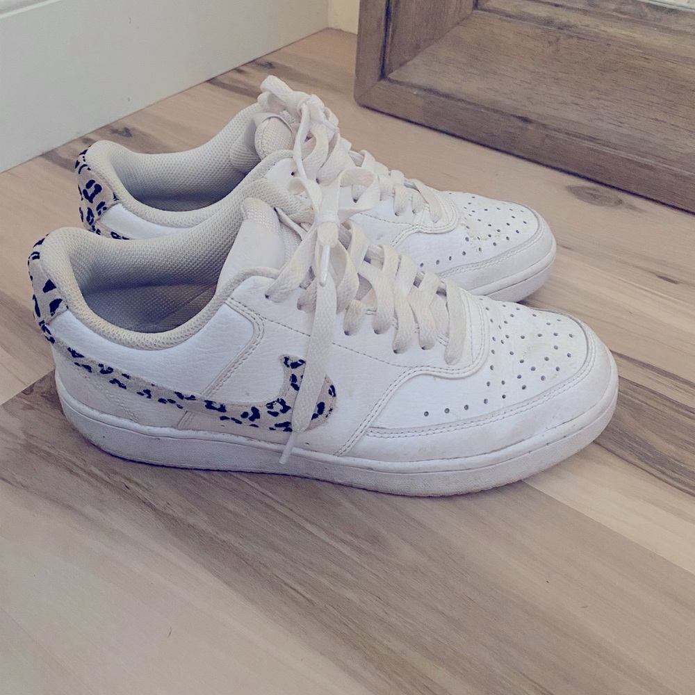 Nike white leather with leopard swoosh